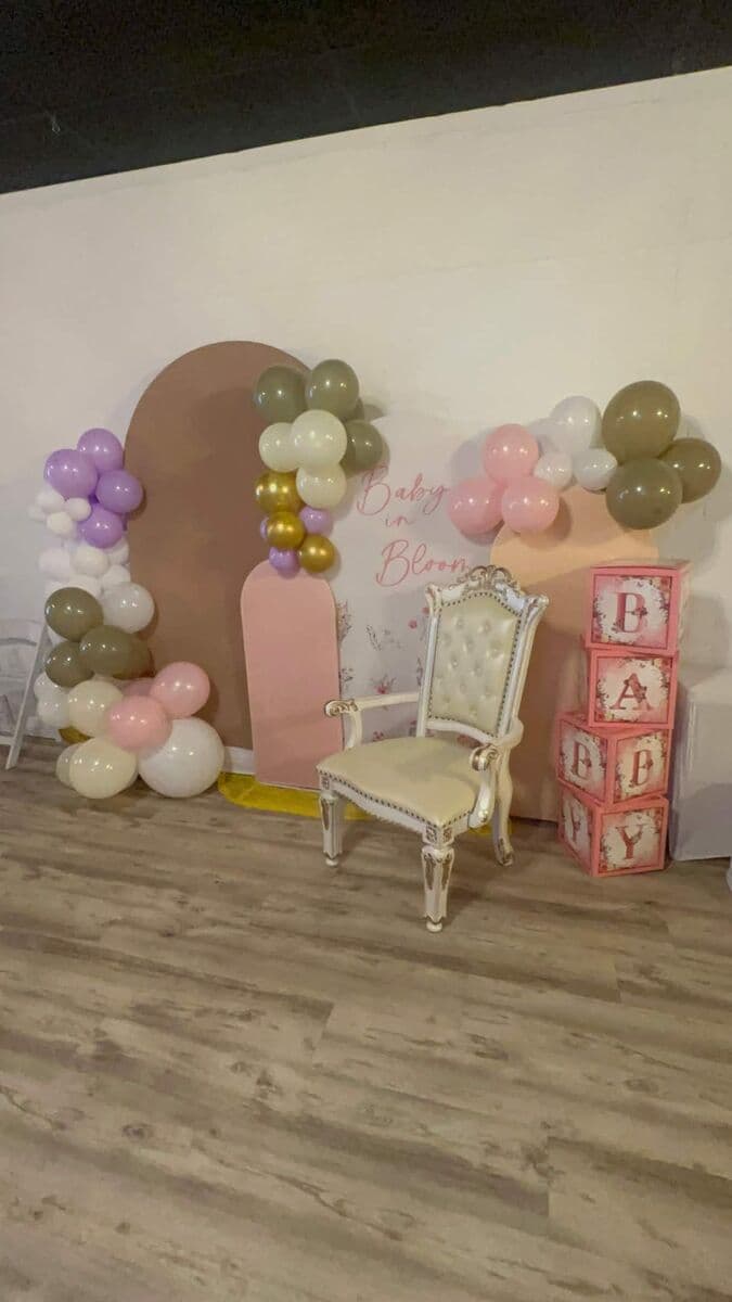 Baby in Bloom theme with balloon arches, throne chair, and BABY letter boxes at LSC Event Space