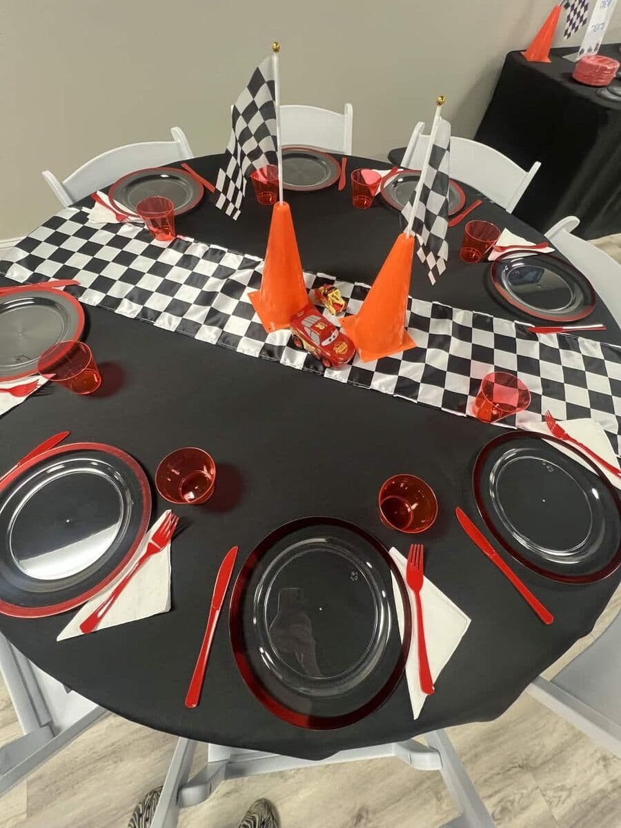Racing Cars birthday theme table setting with checkered flag runner