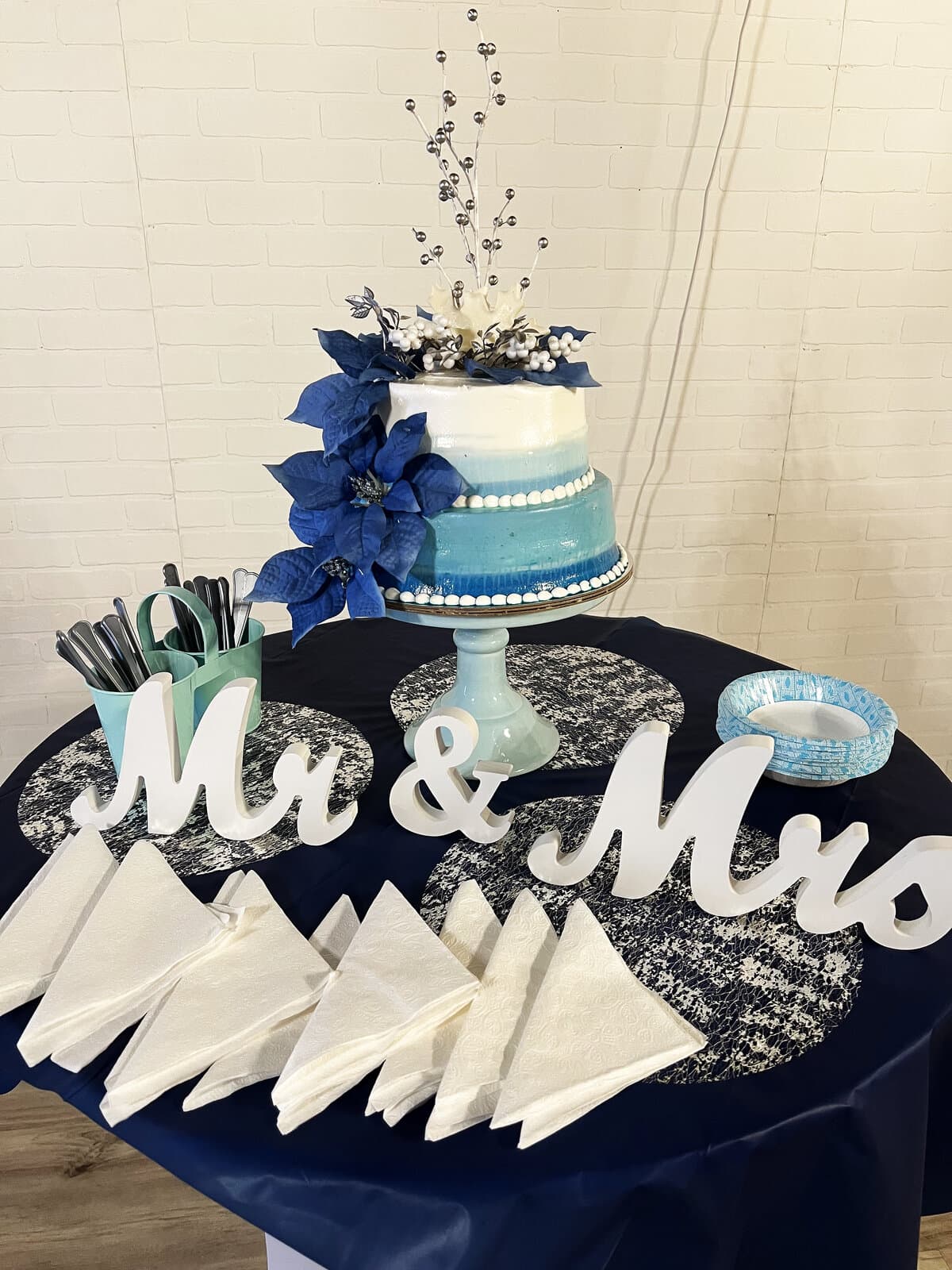 Wedding cake table with Mr and Mrs sign at LSC Event Space
